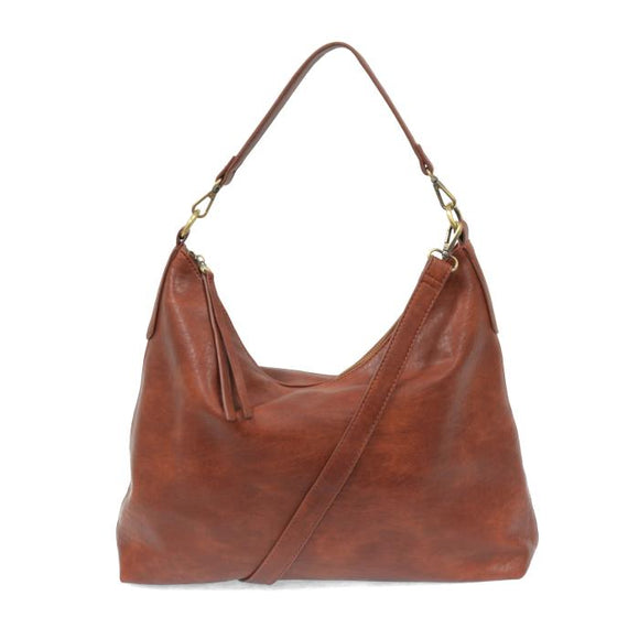 This oversized, slouchy, cool hobo bag is made of tumbled buffalo grain cinnamon-colored vegan leather, which gives it that casual boho chic look! With two included removable shoulder straps, you can wear it as a short shoulder bag or a crossbody bag.