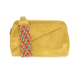 Retro styling crafted in antiqued vegan leather gives this awesome mellow yellow clutch a vintage vibe. The removable woven wrist strap is the finishing touch on this stylish bag, so you can wear it as a wristlet, a clutch, or a crossbody with the removable shoulder strap included!      6.75"H x 9.75"W x 2.25"D