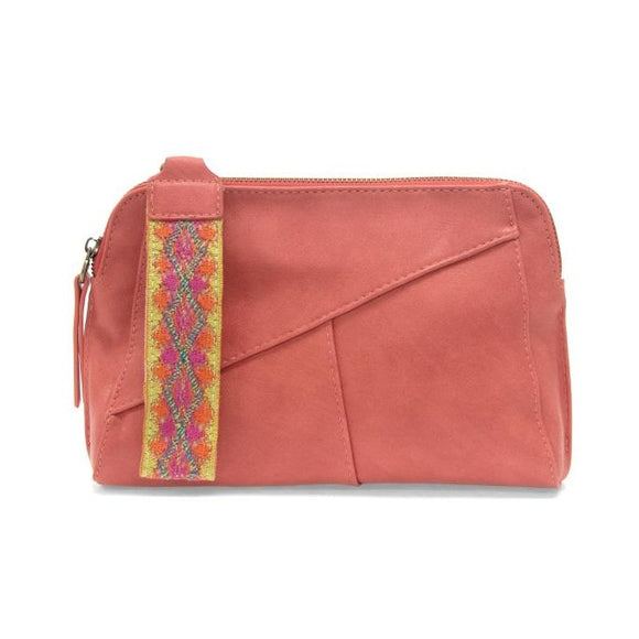 Retro styling crafted in antiqued vegan leather gives this bright coral colored clutch a vintage vibe. The removable woven wrist strap is the finishing touch on this stylish bag, so you can wear as a wristlet, a clutch, or even a crossbody with the included removable shoulder strap!   6.75