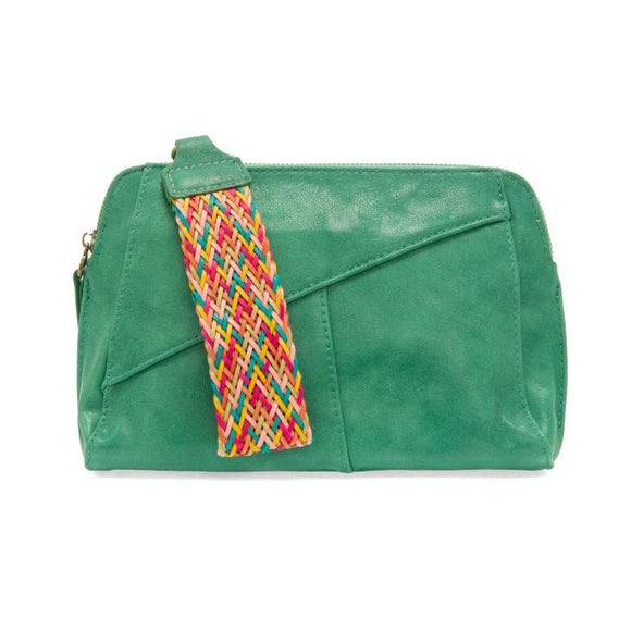 Retro styling crafted in antiqued vegan leather gives this fun jungle green-colored clutch a vintage vibe. The removable woven wrist strap is the finishing touch on this stylish bag so you can wear it as a wristlet, a clutch, or a crossbody with the included removable shoulder strap!      6.75