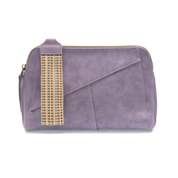 Retro styling crafted in antiqued vegan leather gives this pretty lavender colored clutch a vintage vibe. The removable woven wrist strap is the finishing touch on this stylish bag, so you can wear it as a wristlet, a clutch, or a crossbody with the included removable shoulder strap!