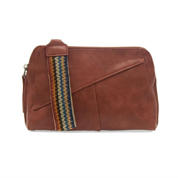 Retro styling crafted in antiqued vegan leather gives this terracotta colored clutch a vintage vibe. The removable woven wrist strap is the finishing touch on this stylish bag so that you can wear it as a wristlet, a clutch, or even a crossbody with the included removable shoulder strap!

6.75