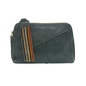 Retro styling crafted in antiqued vegan leather gives this azure colored clutch a vintage vibe. The removable woven wrist strap is the finishing touch on this stylish bag so that you can wear it as a wristlet, a clutch, or even a crossbody with the included removable shoulder strap!   6.75"H x 9.75"W x 2.25"D