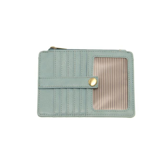 We love this mini wallet in a blue sugar vegan leather! It is full of style and will hold your license and up to six credit cards. The zipper pocket is roomy enough for your change and cash, and a pocket is on the back.  This mini wallet is perfect for you, but it makes an awesome gift!

DIMENSIONS: 4 IN. H X 5.5 IN. W X .25 IN. D