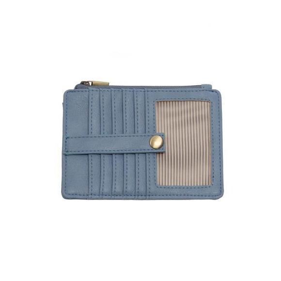 We love this mini wallet in a pretty tranquil blue colored vegan leather! It is full of style and will hold your license and up to six credit cards. The zipper pocket is roomy enough for your change and cash, and a pocket is on the back.  This mini wallet is perfect for you, but it makes an awesome gift!  DIMENSIONS: 4 IN. H X 5.5 IN. W X .25 IN. D  ZIPPERED TOP CLOSURE ON EDGE  6 CREDIT CARD POCKETS  ID WINDOW POCKET