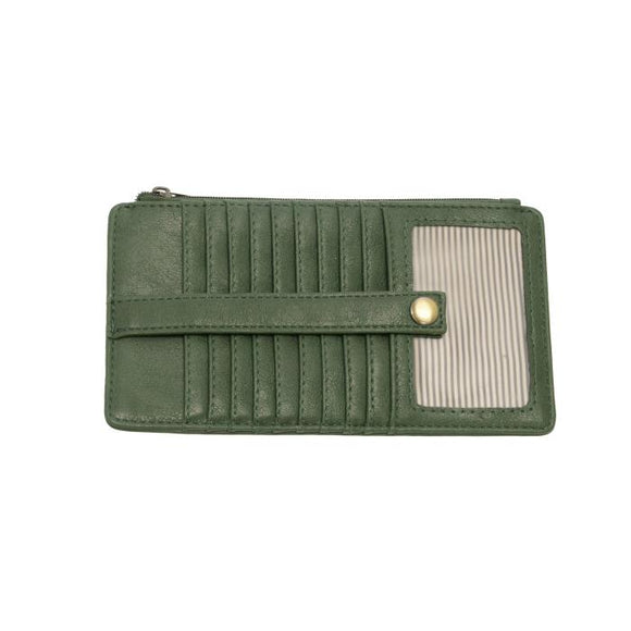 This slim and sleek wallet has nine credit card pockets, each with a snap tab for security and brass-plated hardware. It also has an ID window, zippered change pocket, and zippered billfold pocket in distressed dark pine green vegan leather.


DIMENSIONS: 3.75 IN. H X 7.25 IN. W X .25 IN. D 


100% Vegan leather (polyurethane)