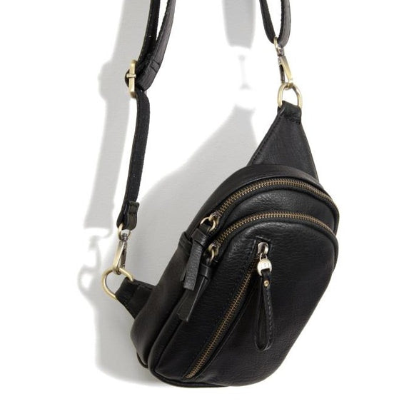 Blending uptown chic with downtown cool, the Skyler sling bag is made in rich vegan black leather! A convertible strap lends versatility, while a front zip pocket offers practical storage for your necessities. It is the perfect companion for a night out on the town or a fun day trip!  8