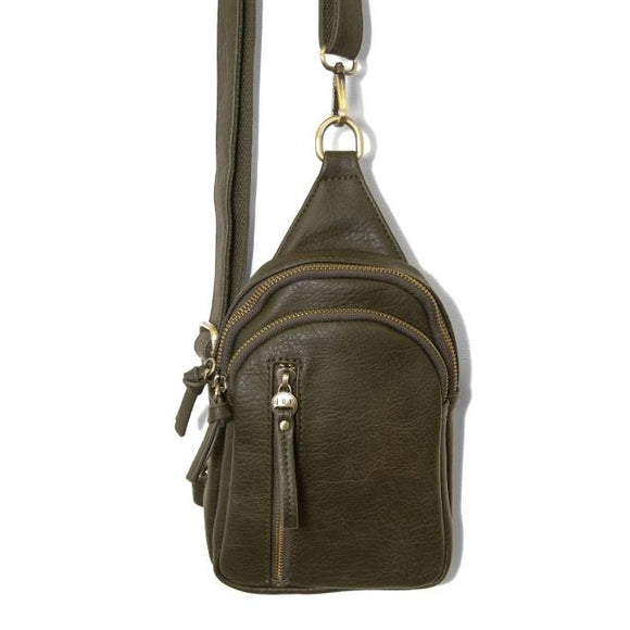 Blending uptown chic with downtown cool, the Skyler sling bag is made in rich vegan dark moss green leather! A convertible strap lends versatility, while a front zip pocket offers practical storage for your necessities. It is the perfect companion for a night out on the town or a fun day trip!  8