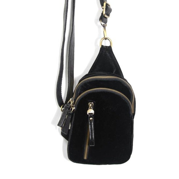 Blending uptown chic with downtown cool, the Skyler sling bag is made in beautiful black velvet! A convertible strap lends versatility, while a front zip pocket offers practical storage for your necessities. It is the perfect companion for a night out on the town or a fun day trip!  8