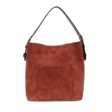 Equally timeless and modern, our best-selling classic hobo is made in rich vegan leather in a beautiful rust faux suede, accented with a brown strap.&nbsp; This roomy bag, accented with a large front pocket and a snap-in removable brown crossbody, has plenty of room to carry your needs in style.