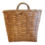 This large chipwood basket will look great hanging on a wall, a door, and even a door knob! Stick in some ivy or flowers that you can change out each season for versatile decorating!

17.5" H x 15.5" W x 9.5" D