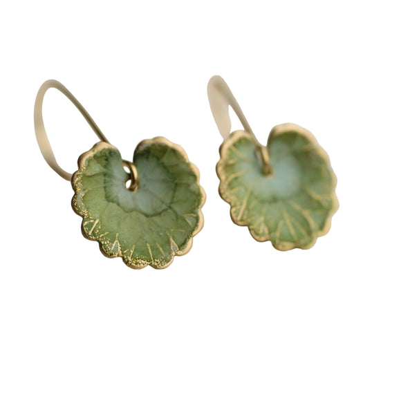 These olive green leaf earrings are brass charms with some amazing detail, which have been carefully treated, painted and varnished to bring out beautiful tones and depth of colour and to show the incredible veining and other details of the metal. These are coloured a beautiful, delicate and multi toned olive green colour. They are designed to be reminiscent of the beautiful, softly coloured lily pads found in Art Nouveau paintings.

The earring measures just under 1