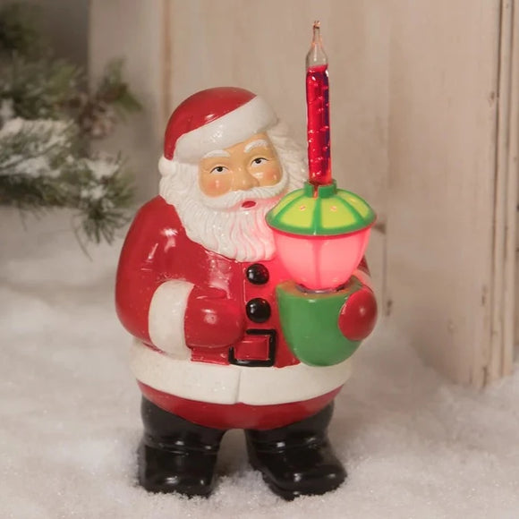 Bring back the nostalgia and memories of holidays gone by with this 1950's vintage-inspired bubble light Santa. Made of hand-glazed resin. electrically wired glass bubble light, and glitter accents. Includes light.   Materials: Glazed resin. Electrically wired bubble light. Includes light. This item plugs into any US outlets.  Dimensions: 7