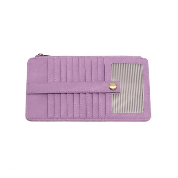 This slim and sleek wallet has nine credit card pockets, each with a snap tab for security and brass-plated hardware. It also has an ID window, zippered change pocket, and zippered billfold pocket in distressed lilac vegan leather.


DIMENSIONS: 3.75 IN. H X 7.25 IN. W X .25 IN. D 


100% Vegan leather (polyurethane)