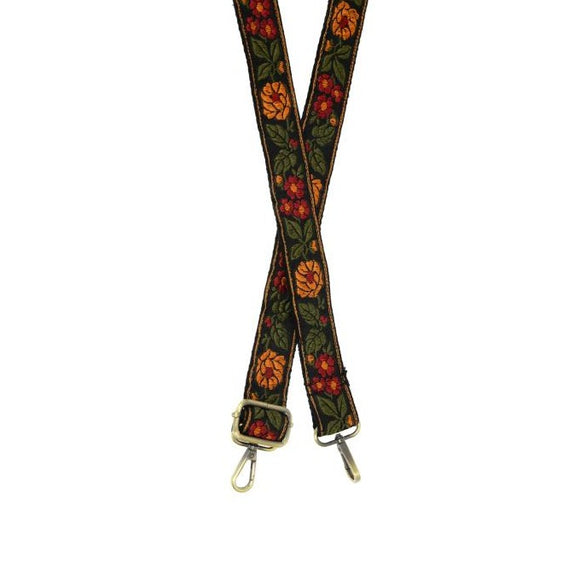 This gorgeous guitar strap will get people talking!  This black strap has gorgeous gold and magenta flowers scattered in olive vines.  The back of this strap is black.  1.25