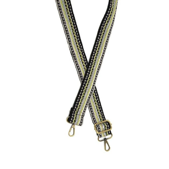 You'll love changing up the style of your purse with one of our guitar straps! This black strap has a white and bright green embroidered design around a silver stripe down the center with pink and blue threads. The back of the strap is solid black.  35