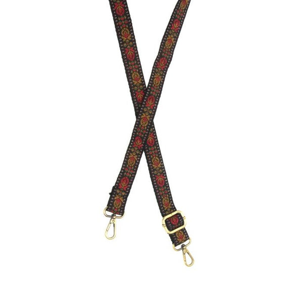 You'll love changing up the style of your purse with one of our guitar straps! This black strap has a beautiful geometric tulip print in reds, olive greens, and golden brown!  The back of the strap is black    35