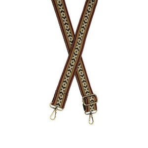 You'll love changing up the style of your purse with one of our guitar straps! This is one of our favorite combinations of red-orange, black, deep gold, and Olive stripes with an "x" and "o" pattern going down the center in white, olive and black.  35"-54" Adjustable length   1.5" wide  Brass plated hardware