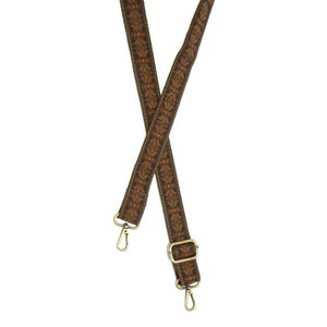 You'll love changing up the style of your purse with one of our guitar straps! The dark tan background has a fun diamond design in greys, purples, pinks, and yellows.  The back of the strap is in the same dark tan as the front.  35"-54" adjustable length   1.2" wide  Brass plated hardware