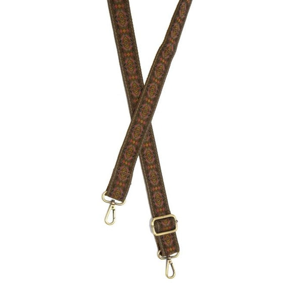You'll love changing up the style of your purse with one of our guitar straps! The dark tan background has a fun diamond design in greys, purples, pinks, and yellows.  The back of the strap is in the same dark tan as the front.  35