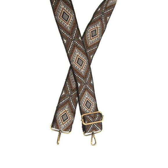 You'll love changing up the style of your purse with one of our guitar straps! This beautifully embroidered strap has embroidered diamonds in black, gold, grey, and white. The back of the strap is solid black.  35