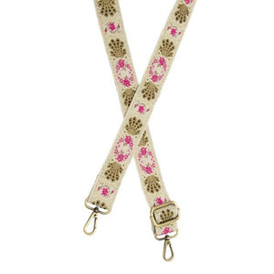 You'll love changing up the style of your purse with one of our guitar straps! This off-white strap has all the bling to give you a summer vibe!  You'll catch all the attention with pink florals and seashells with gold metallic threads running through this jacquard strap!  35"-54" adjustable length  1.5" wide  Brass plated hardware