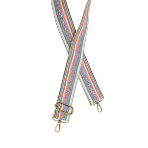 Make your purse or crossbody HAPPY with this fun striped guitar strap with a white background and denim blue, yellow, red and orange stripes in different sizes going down the strap!&nbsp;The back of the strap is off white/cream.

2" wide

35-54" adjustable length

Brass plated hardware

100% Cotton