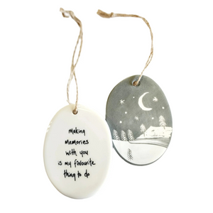 We love our porcelain ornaments because they are perfect for gift-giving! This oval ornament says, "Making memories with you is my favourite thing to do" on one side. The other side has a grey background with&nbsp;a mountain scene with stars and the moon in the sky, all in white.


Dimensions:&nbsp;2" W x 2 3/4" H