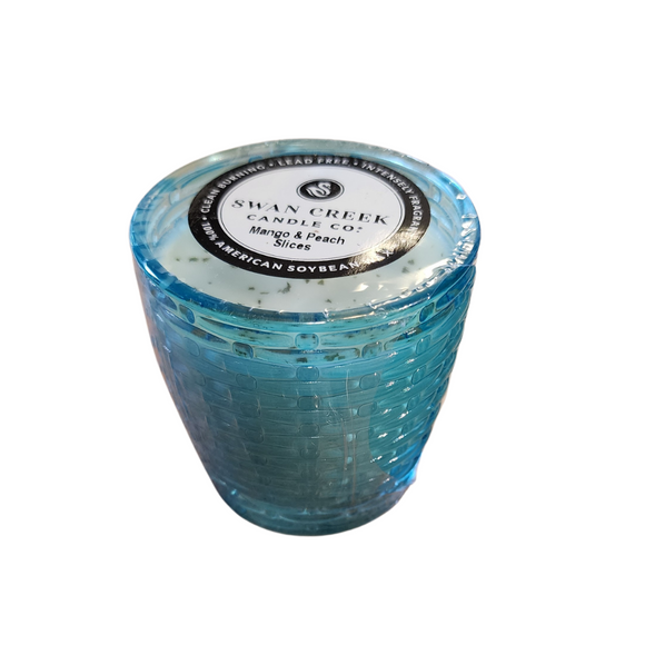 You'll love our cathedral small vase candle. This mango & peach slices candle has been poured into a pretty basketweave blue glass.

Fresh juicy peaches meet sweet mangos for the delightful fruity fragrance sure to please all!

Filled with 4.5 oz. of American Soybean WaxTM. Measures 3