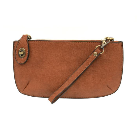 Our most popular bag, this mini clutch, with its sleek silhouette, is as gorgeous as it is versatile.  Features include a polished turn lock, six card slots, and an interior zipper for change.  It can be styled in many ways, with removable straps to alternate between wallet, crossbody, and wristlet!   5