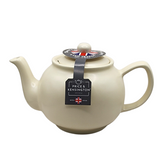 When it's time for a spot of tea, reach for one of our stoneware teapots, which can absorb the heat of boiling water without cracking. Likewise, the beautiful exterior is protected with a gloss to prevent the paint from warping or rippling. The classic bulbous shape allows tea leaves or bags to move freely for just the right amount of flavoring.&nbsp;

The matte cream teapot is available in 2-cup or 6-cup size