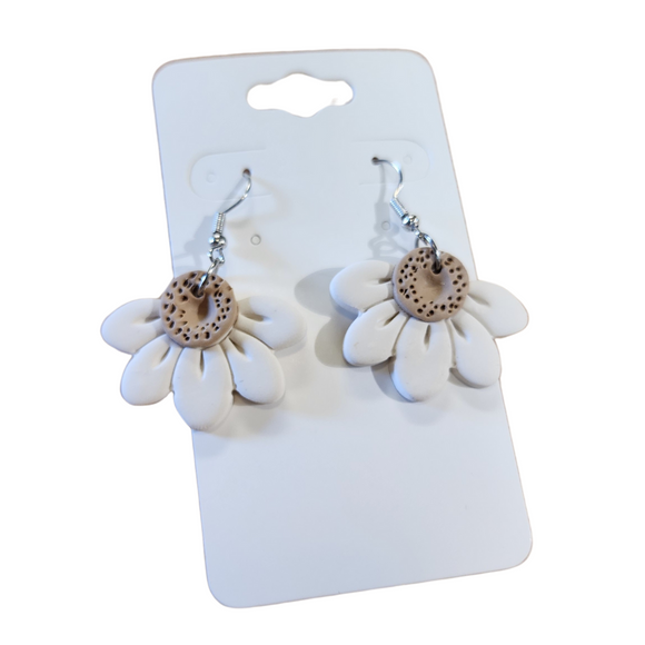 You will love these lightweight, trendy polymer clay daisy earrings that are the cutest! This one has five smooth petals in cream with earring hooks are comfortable and easy to wear and made of high-quality, strong/durable stainless steel, which is hypoallergenic and nickel-free. * 

This versatile earring design would accompany any outfit, from casual to dressed up! 

Handcrafted in Texas, USA 

CARE INSTRUCTIONS FOR EARRINGS * Store in a clean, dry place. * To clean: rub gently with a soft 