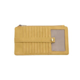 This slim and sleek wallet has nine credit card pockets, each with a snap tab for security and brass-plated hardware. It also has an ID window, zippered change pocket, and zippered billfold pocket in distressed mellow yellow vegan leather.


DIMENSIONS: 3.75 IN. H X 7.25 IN. W X .25 IN. D&nbsp;


100% Vegan leather (polyurethane)