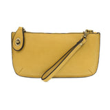 Our most popular bag, in a beautiful butter yellow color, this mini clutch, with its sleek silhouette, is as gorgeous as it is versatile.&nbsp; Features include a polished turn lock, six card slots, and an interior zipper for change.&nbsp; It can be styled in many ways, with removable straps for alternating between wallet, crossbody, and wristlet!

&nbsp;5"H x 9.5"W x 1"D

Removable and adjustable crossbody strap 13"-24"

Wristlet strap 7" long

interior zippered pocket

brass plated hardware

100% vegan le