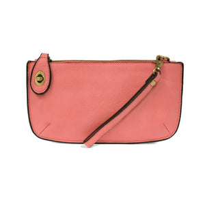 Our most popular bag, in a beautiful flamingo pink, this mini clutch, with its sleek silhouette, is as gorgeous as it is versatile.&nbsp; Features include a polished turn lock, six card slots, and an interior zipper for change.&nbsp; It can be styled in many ways, with removable straps for alternating between wallet, crossbody, and wristlet!

&nbsp;5"H x 9.5"W x 1"D

Removable and adjustable crossbody strap 13"-24"

Wristlet strap 7" long

interior zippered pocket

brass plated hardware

100% vegan leather 