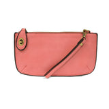 Our most popular bag, in a beautiful flamingo pink, this mini clutch, with its sleek silhouette, is as gorgeous as it is versatile.&nbsp; Features include a polished turn lock, six card slots, and an interior zipper for change.&nbsp; It can be styled in many ways, with removable straps for alternating between wallet, crossbody, and wristlet!

&nbsp;5"H x 9.5"W x 1"D

Removable and adjustable crossbody strap 13"-24"

Wristlet strap 7" long

interior zippered pocket

brass plated hardware

100% vegan leather 