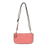 Our most popular bag, in a beautiful flamingo pink, this mini clutch, with its sleek silhouette, is as gorgeous as it is versatile.&nbsp; Features include a polished turn lock, six card slots, and an interior zipper for change.&nbsp; It can be styled in many ways, with removable straps for alternating between wallet, crossbody, and wristlet!

&nbsp;5"H x 9.5"W x 1"D

Removable and adjustable crossbody strap 13"-24"

Wristlet strap 7" long

interior zippered pocket

brass plated hardware

100% vegan leather 