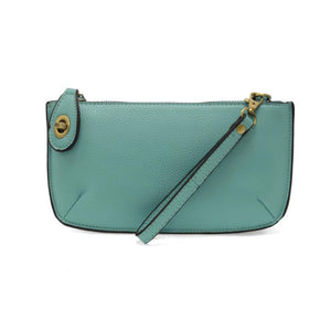 Our most popular bag, in a beautiful fresh aqua, this mini clutch, with its sleek silhouette, is as gorgeous as it is versatile.&nbsp; Features include a polished turn lock, six card slots, and an interior zipper for change.&nbsp; It can be styled in many ways, with removable straps for alternating between wallet, crossbody, and wristlet!

&nbsp;5"H x 9.5"W x 1"D

Removable and adjustable crossbody strap 13"-24"

Wristlet strap 7" long

interior zippered pocket

brass plated hardware

100% vegan leather (po