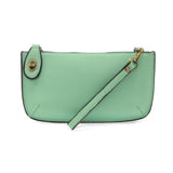 Our most popular bag, in a beautiful hint of mint, this mini clutch, with its sleek silhouette, is as gorgeous as it is versatile.&nbsp; Features include a polished turn lock, six card slots, and an interior zipper for change.&nbsp; It can be styled in many ways, with removable straps for alternating between wallet, crossbody, and wristlet!

&nbsp;5"H x 9.5"W x 1"D

Removable and adjustable crossbody strap 13"-24"

Wristlet strap 7" long

interior zippered pocket

brass plated hardware

100% vegan leather (