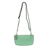 Our most popular bag, in a beautiful hint of mint, this mini clutch, with its sleek silhouette, is as gorgeous as it is versatile.&nbsp; Features include a polished turn lock, six card slots, and an interior zipper for change.&nbsp; It can be styled in many ways, with removable straps for alternating between wallet, crossbody, and wristlet!

&nbsp;5"H x 9.5"W x 1"D

Removable and adjustable crossbody strap 13"-24"

Wristlet strap 7" long

interior zippered pocket

brass plated hardware

100% vegan leather (