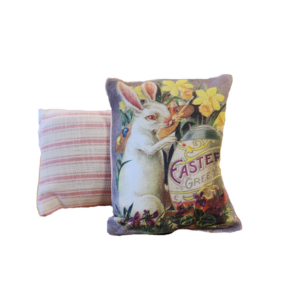 This adorable mini vintage postcard pillow has a bunny painting an egg that says with 