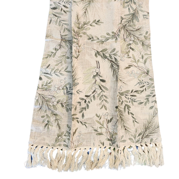 For the holidays, add this exquisite kitchen towel, adorned with delightful pine branches and mistletoe in rich greens and greys on a soft cream muslin fabric. The elegant cream fringe along the bottom adds a charming finishing touch that elevates any culinary space.

27