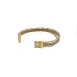 You'll love how easy it is to put this magnetic clasp bracelet on and take off!&nbsp; This bracelet has two glitzy gold, clear and greyish beaded strands on either side of a cream leather band with a sparkly strand in the center of it.

Approximately 1/2" W x&nbsp; 7.75" L