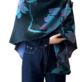 Cozy Cashmere Like Travel Wrap This one size fits all reversible loop wrap, drapes over and through shoulder loop to stay in place. Accents any outfit, casual or dressy. It feels and looks like cashmere. A beautiful layering piece!

60% Poly, 40% Acrylic.

Dry clean or hand wash cold with light colors, lay flat to dry, iron on lowest setting if need, do not bleach.