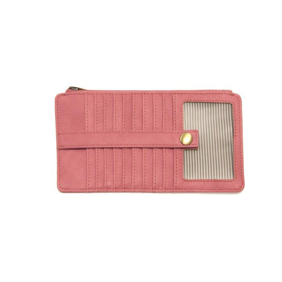 This slim and sleek wallet has nine credit card pockets, each with a snap tab for security and brass-plated hardware. It also has an ID window, zippered change pocket, and zippered billfold pocket in distressed pink punch vegan leather.


DIMENSIONS: 3.75 IN. H X 7.25 IN. W X .25 IN. D 


100% Vegan leather (polyurethane)