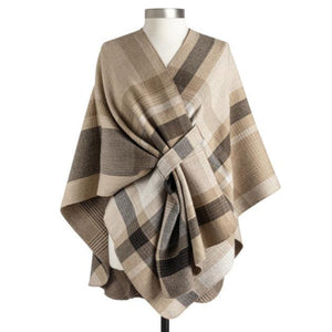 This beautiful wrap will be a staple in your closet this year! It can hang loosely, but we love the option of tucking in one front end into the loop attached to this wrap that does double duty because it reverses to a smaller camel plaid on the other side - woohoo! Two wraps in ONE to stretch out your wardrobe, giving so many options!  100% Polyester  One size fits most. Laid flat measurements are approximately&nbsp; 44" W x 32" L&nbsp;  Care: Machine wash cold, tumble dry low. Do not bleach.