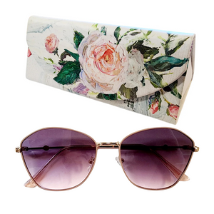 These frames feature gradient plum lenses that provide both style and sun protection. The accompanying collapsible floral printed case adds a touch of convenience and charm. Whether lounging on the beach or strolling through the city, these sunglasses are the perfect way to add color and style to your look.
It comes with a coordinating triangle-shaped case with a floral design
Gradient Lens
100% UV protection


sunglasses: 5 1/2"W x 2"L x 1"H


case: 6 1/2" W x 3" L x 2" H