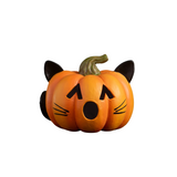 Bring some feline fun to your Halloween decor with our delightful Pumpkin Cat Luminary! This playful piece features cut-out eyes and an 'O' shaped mouth, ready to glow when you place a battery-operated light inside through the bottom opening. Topped with cute cat ears, it also has painted whiskers and a curled tail wrapping around the side, giving it extra character. This adorable pumpkin cat is the perfect blend of spooky and sweet, making it an eye-catching addition to your seasonal display. It will add a