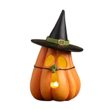 Bring a touch of whimsical magic to your Halloween decor with our enchanting Pumpkin Witch Luminary! This charming pumpkin features cut-out eyes and mouth, perfect for showcasing a glowing battery-operated light from the bottom. Atop the pumpkin sits a whimsical witch hat tilted just so, adding a playful flair. Completing the look is a long green witch nose, humorously appearing as if it's held on by a string. This delightful luminary is sure to cast a spell of charm and light in any space, making it a must