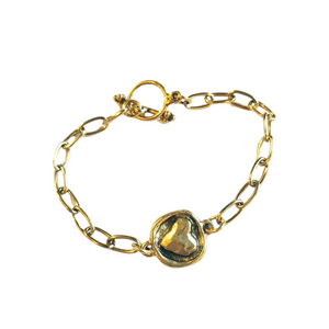 This simple, but elegant bracelet has pretty gold link chains on either side of a beautiful gold embossed heart and has a toggle closure. It is the perfect size to wear every day and can be worn alone or with other bracelets.

7" long